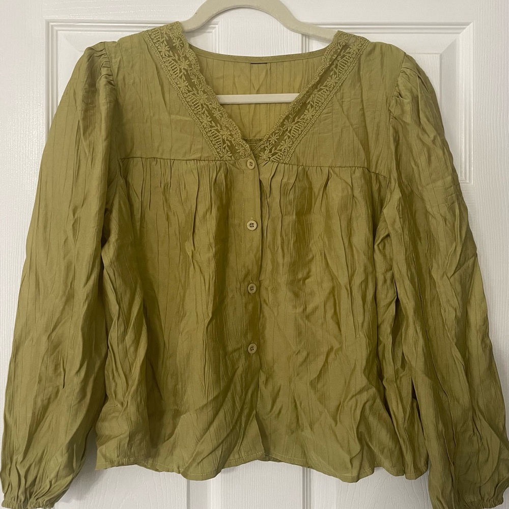 Women’s olive green lace lantern sleeve blouse.